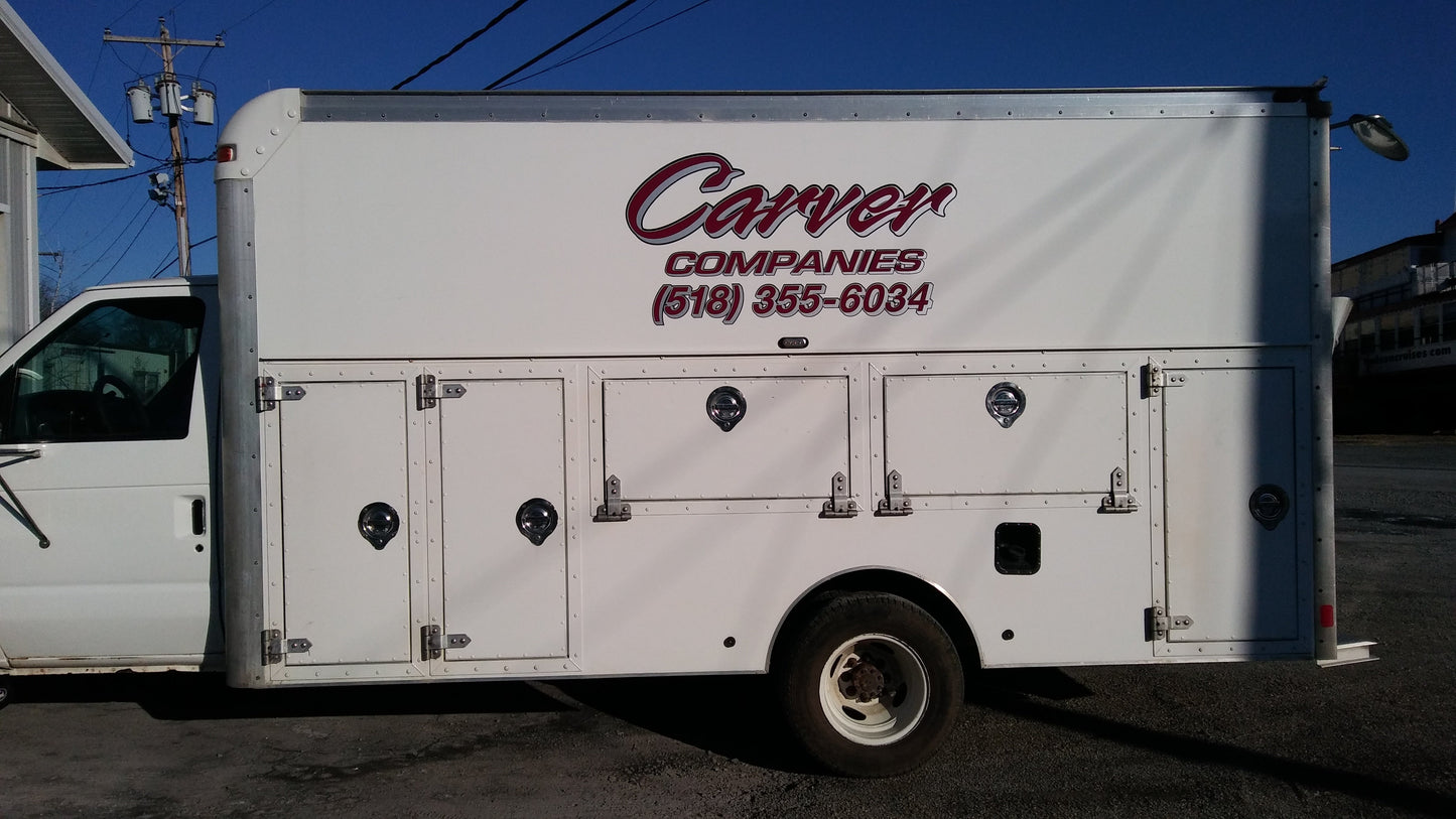 Vehicle lettering made from high quality printed and laminated cast vinyl. The vinyl decals are shown installed on a service truck.