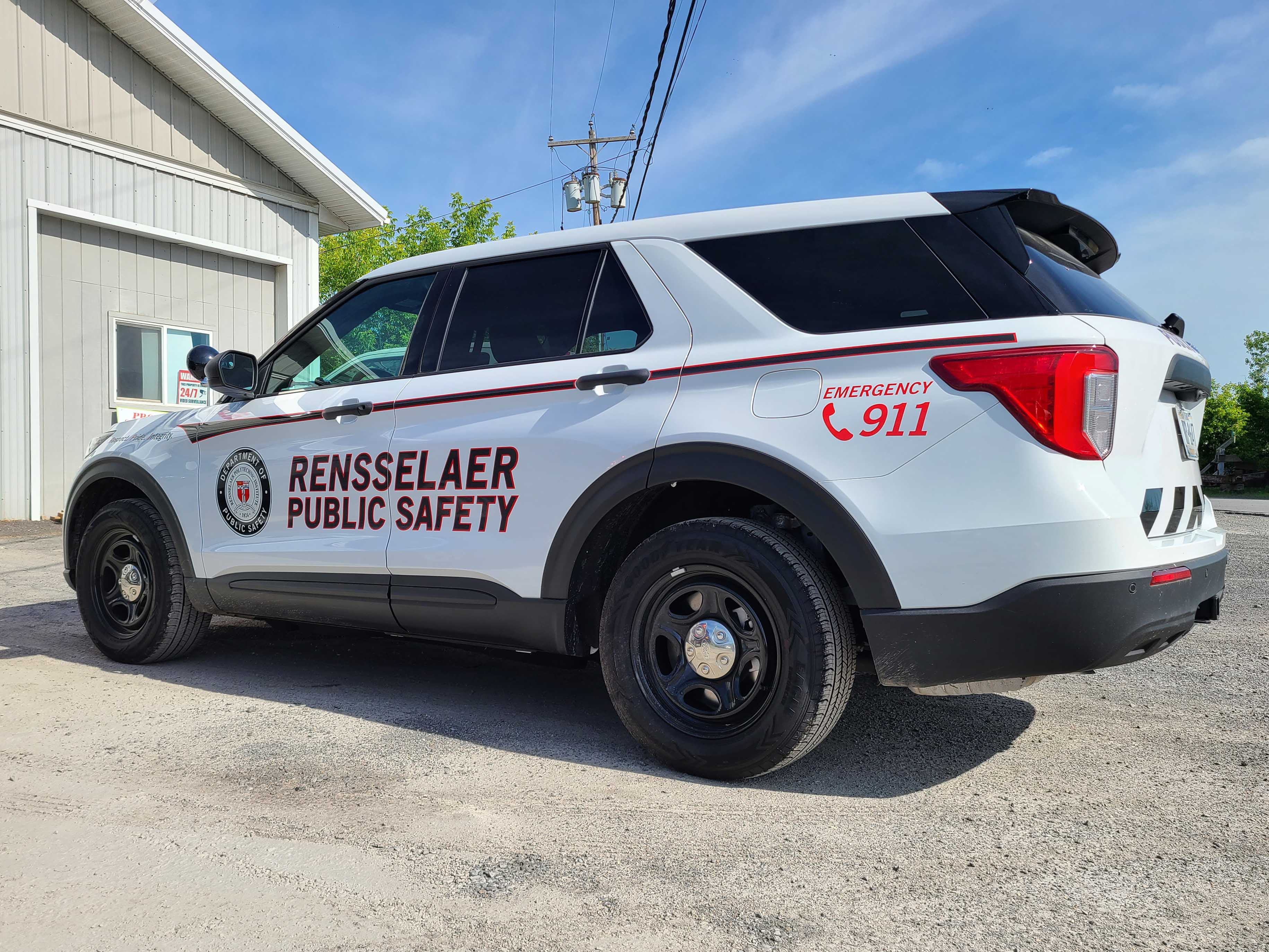 Security patrol car graphics installed by All Signs & Graphics Inc on this SUV. Red and black reflective striping and reflective lettering and seal printed on premium cast vinyl materials and overlamianted with cast laminate for added protection and durabillity.