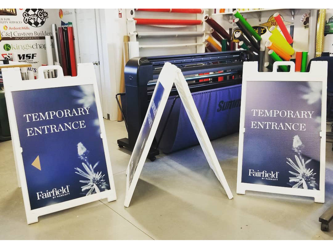 A-Frame signicade sidewalk signs on display. Double sided plastic signicade deluxe with custom printed sandwich board sign inserts.