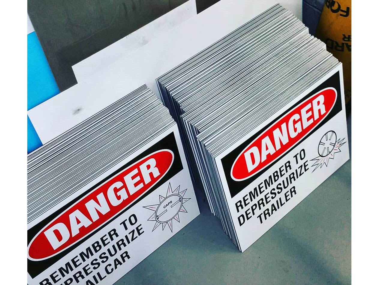 Large order of dibond danger signs. Aluminum composite safety signs are outdoor durable.