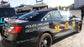 Vinyl wrap installed by All Signs & Graphics Inc on police car.  Gold leaf vinyl and reflective vinyl graphics installed on top of vinyl wrap.