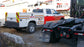 Fire truck lettering installed on utility truck by All Signs & Graphics Inc.  Red vinyl wrap on cab of truck with reflective stripe and gold leaf vinyl lettering installed on the doors.  Safety fluorescent yellow and red prismatic reflective vinyl chevrons installed on rear as well as truck unit numbers.