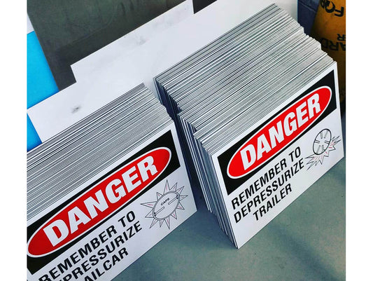 Large order of dibond danger signs.  Aluminum composite safety signs are outdoor durable.